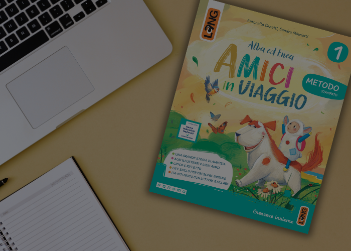 Computer e copertina del libro Amici in viaggio